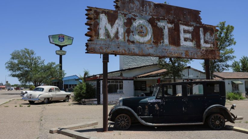 Rusty MOTEL sign, classic cars, and Route 66 Kix on 66 sign in Tucumcari, NM for a US road trip