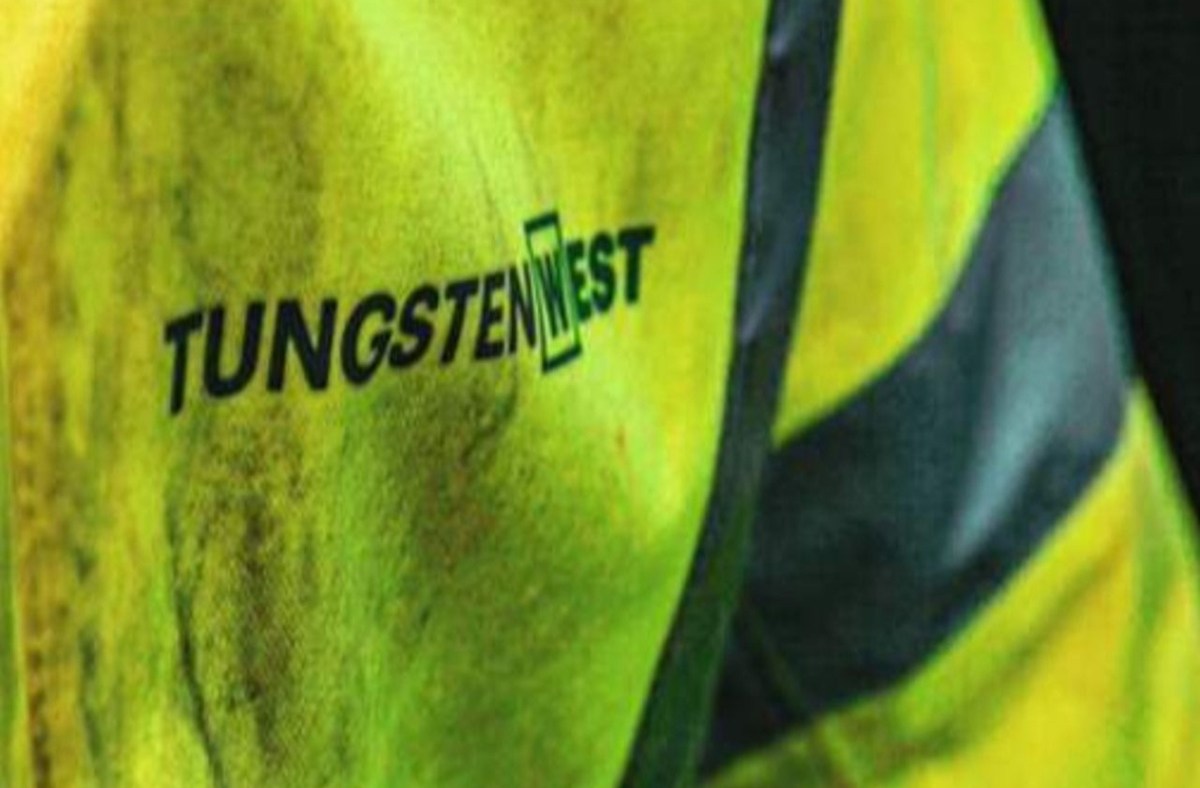 Tungsten West logo on a neon yellow high-visibility jacket with reflective stripes, suggesting mining or industrial work.