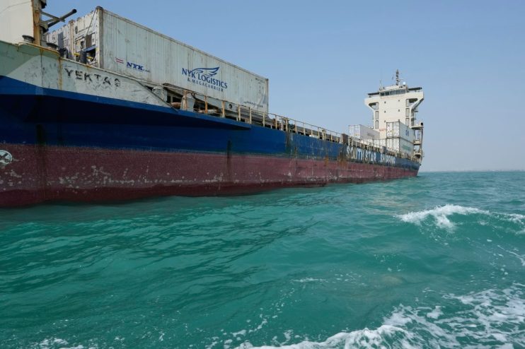 Large cargo ship YEKTA S with NYK Logistics containers on turquoise water, SOUTH STAR SHIPPING visible.