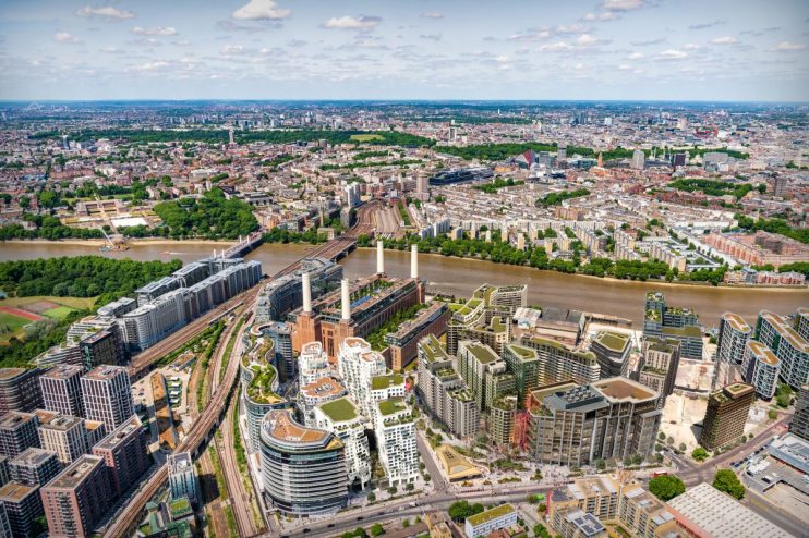 CGI rendering of Battersea Power Stations future development with new buildings and green spaces along the River Thames.