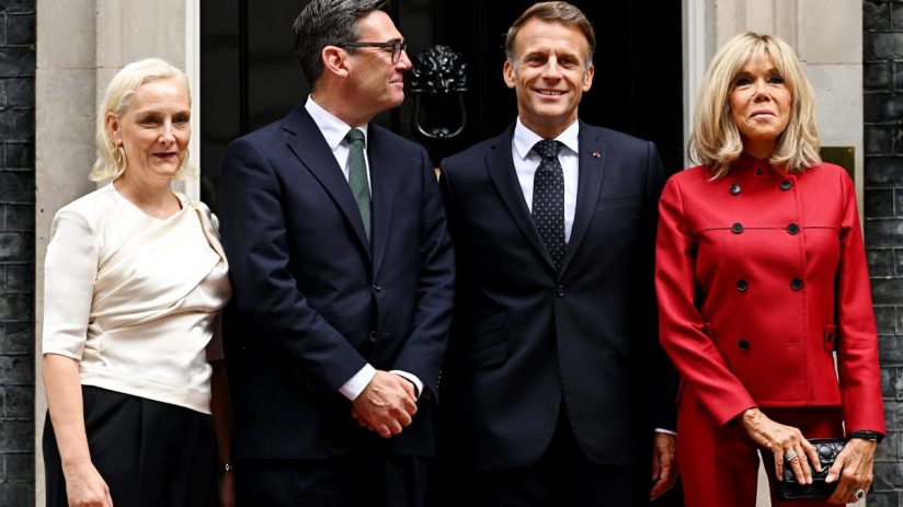 Emmanuel Macron, Brigitte Macron, and UK officials outside 10 Downing Street