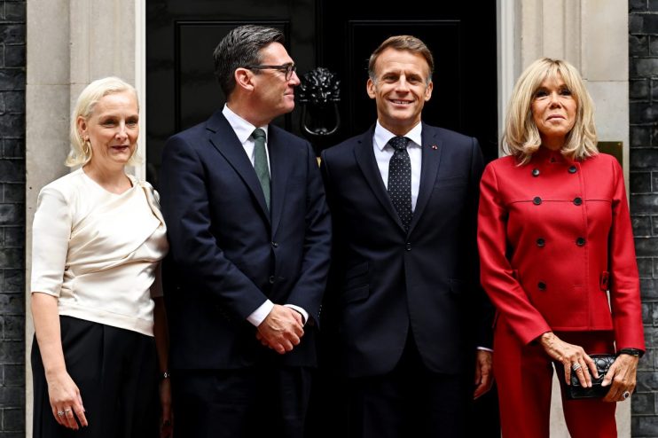 Emmanuel Macron, Brigitte Macron, and UK officials outside 10 Downing Street