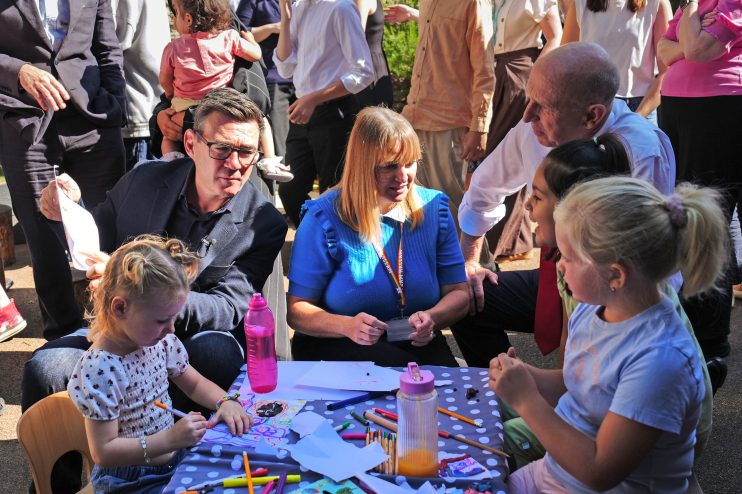 Andy Burnham and Tracy Brabin interacting with children at an outdoor event