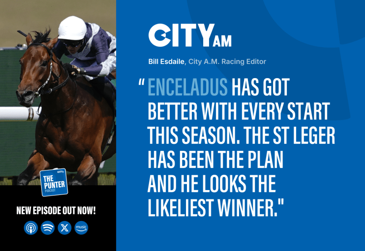 Jockey in white helmet and blue silks riding a racehorse in a CityAM racing article.