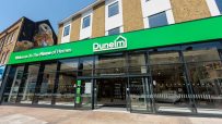 Exterior of the new Dunelm Kingston superstore with a bright green facade and large glass windows.