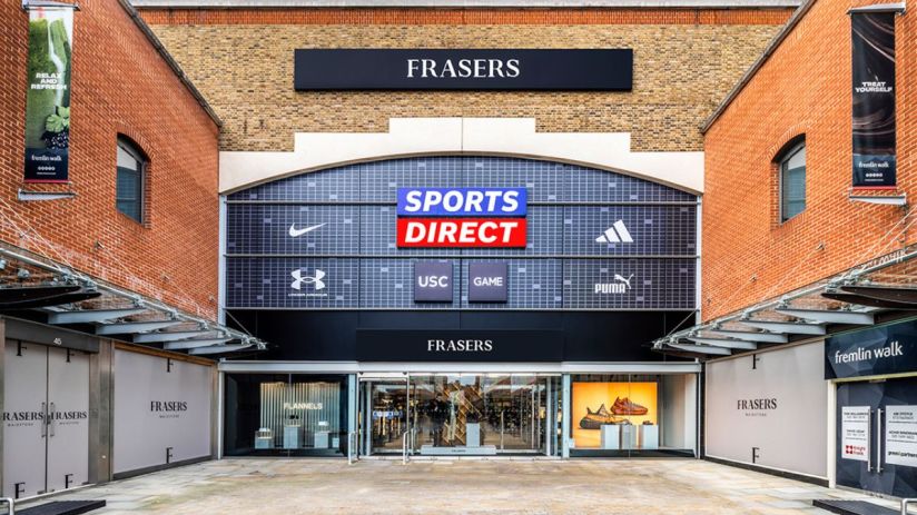 Frasers Group retail store exterior with prominent Sports Direct, Flannels, USC, and GAME branding.