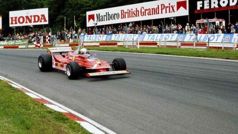 Red Formula 1 race car on track with Honda, Marlboro British Grand Prix, and Talbot signs
