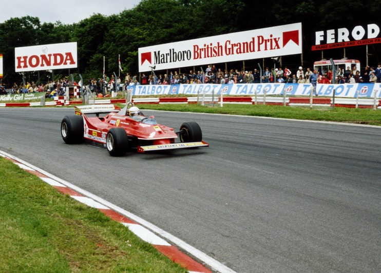 Red Formula 1 race car on track with Honda, Marlboro British Grand Prix, and Talbot signs