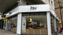 itsu restaurant storefront with eat beautiful slogan, showcasing Asian salads, sushi, soups, and rice bowls.