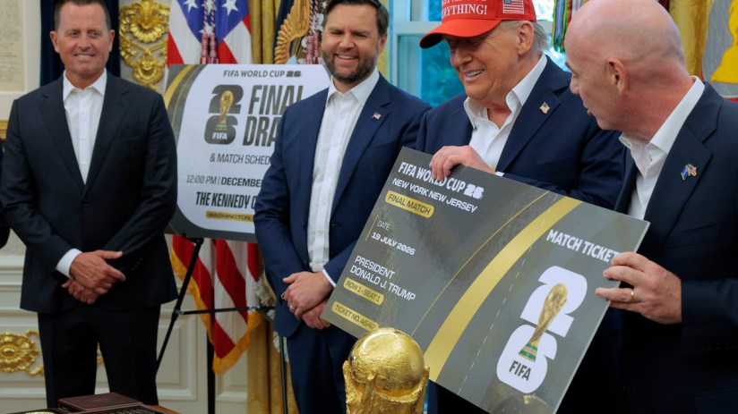 Donald Trump, in a red Trump Was Right About Everything hat, holds a FIFA World Cup 2026 ticket.
