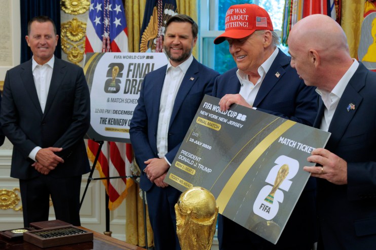 Donald Trump, in a red Trump Was Right About Everything hat, holds a FIFA World Cup 2026 ticket.