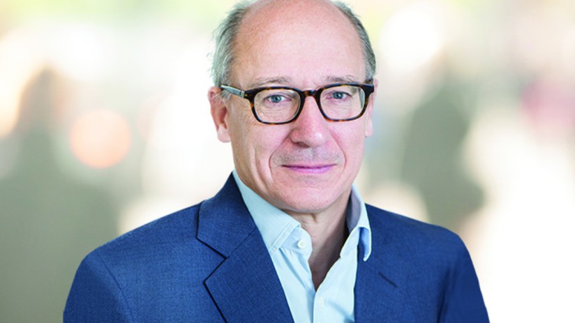 Michael Lindsell in 2022, a man wearing glasses and a blue suit jacket, for a business news context.