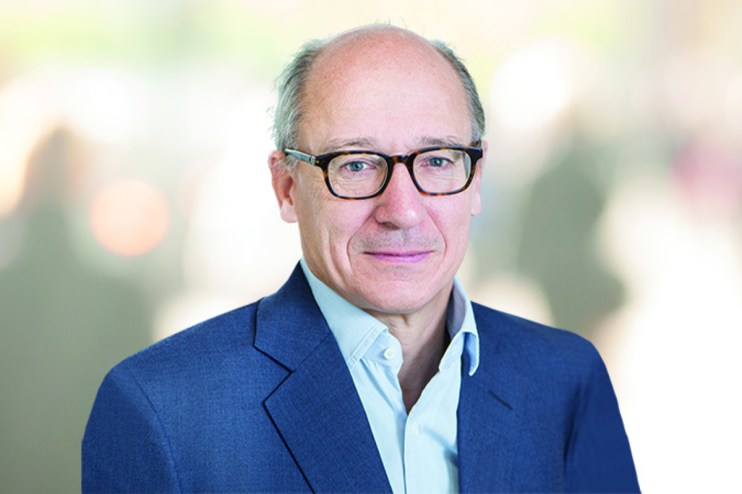 Michael Lindsell in 2022, a man wearing glasses and a blue suit jacket, for a business news context.