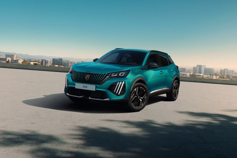Teal Peugeot 3008 SUV on a rooftop parking lot with a city skyline in the background.