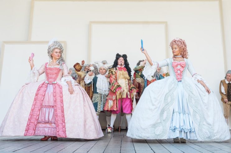Performers in elaborate 18th-century costumes for As You Like It at Shakespeares Globe, Marc Brenner photo.