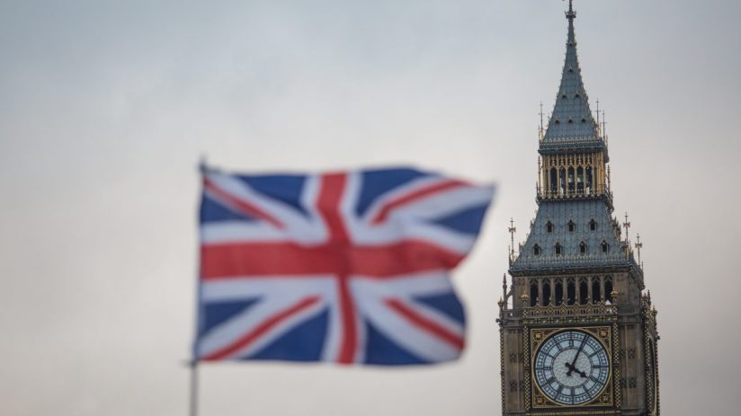 Union Jack flag in front of Elizabeth Tower (Big Ben), Houses of Parliament, London, UK