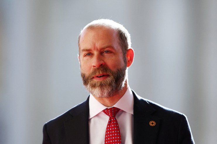 Jonathan Reynolds, Shadow Business Secretary, wearing a suit and red patterned tie.