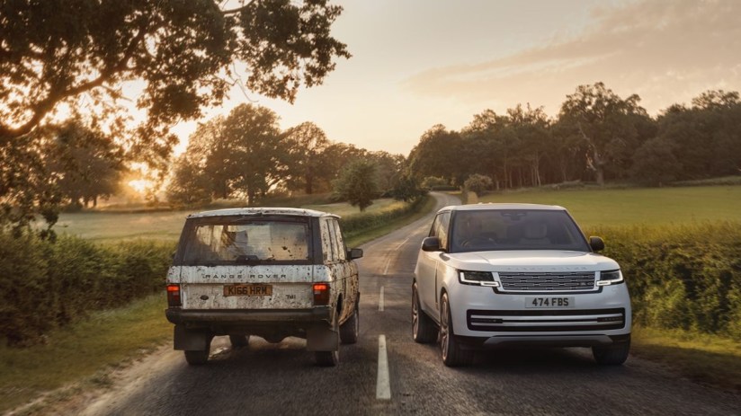 Classic and modern Range Rovers on a country road at sunrise, showcasing design evolution.