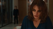 Pen&eacute;lope Cruz with a worried expression, a blurry man in the background, likely from a Venice Film Festival film.