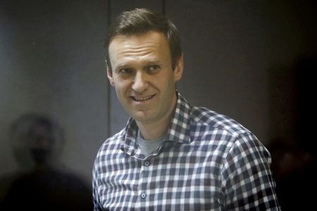 More than 400 people have been detained in Russia while paying tribute to opposition leader Alexei Navalny, who died at a remote Arctic prison colony, a prominent rights group has reported.